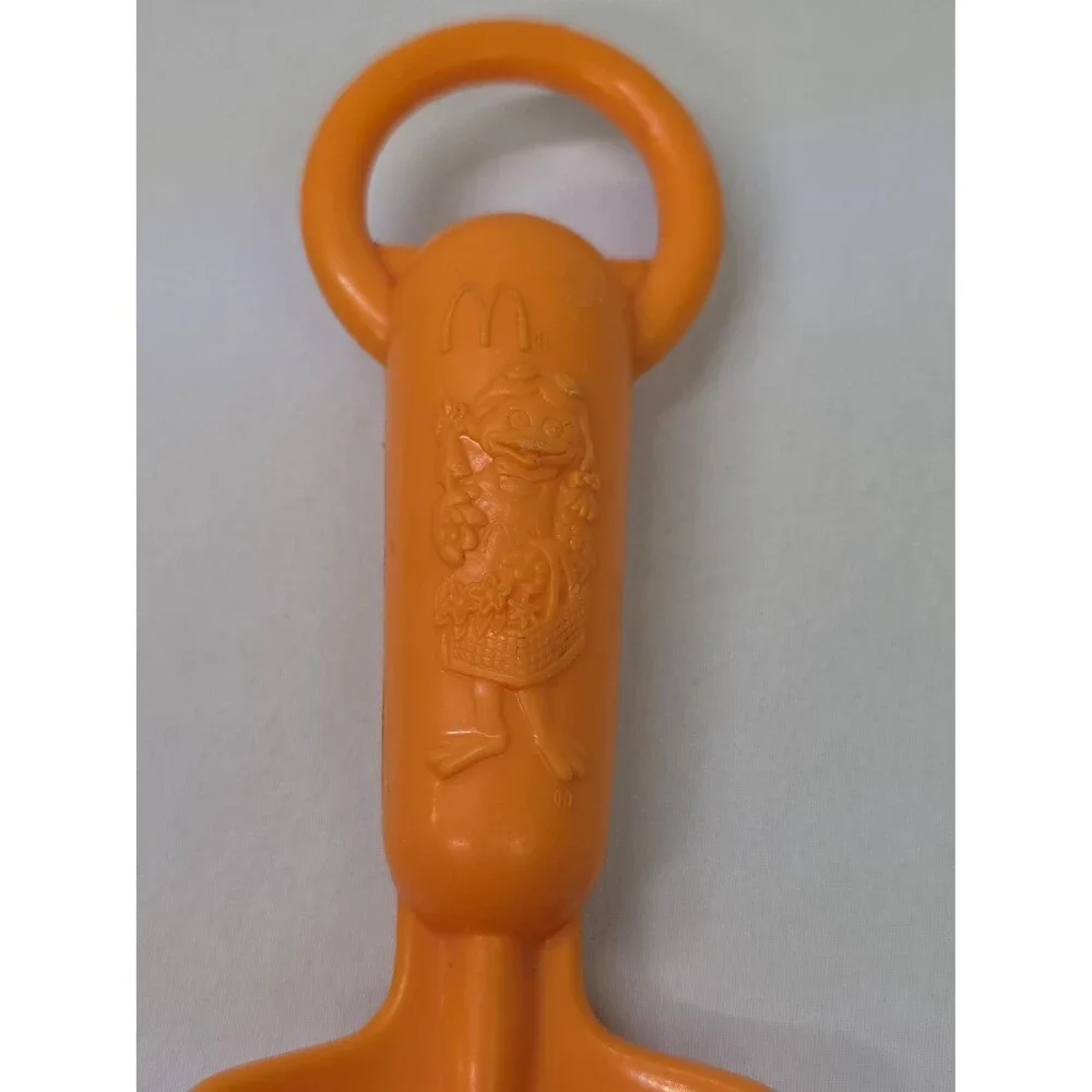 Vintage Collectable Kids Orange McDonalds Birdie the early bird garden shovel